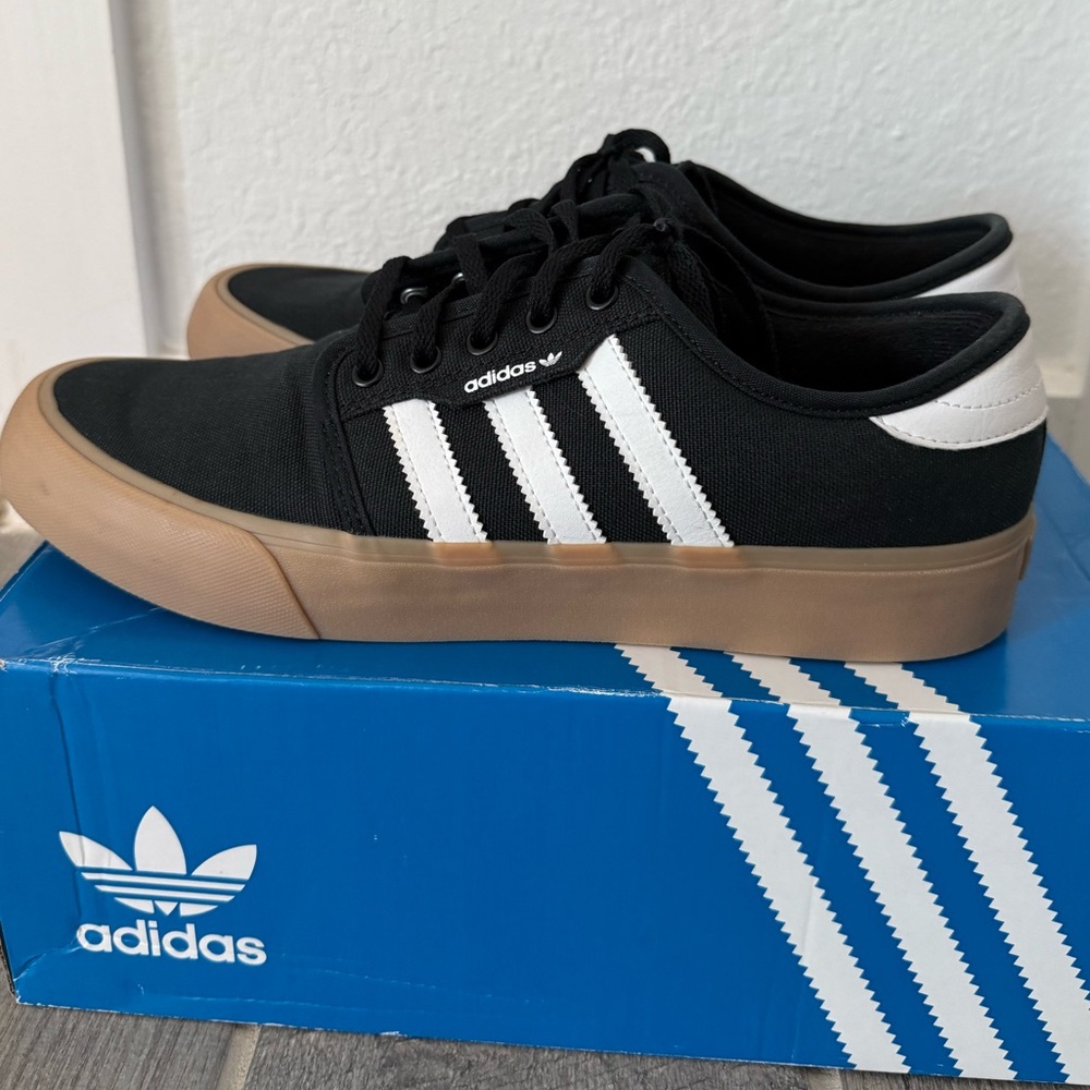 adidas Originals Seeley XT sneakers in black with gum sole.